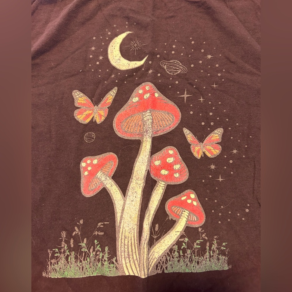 Cropped T w graphic of a crescent moon, mushrooms, stars, planets & butterflies